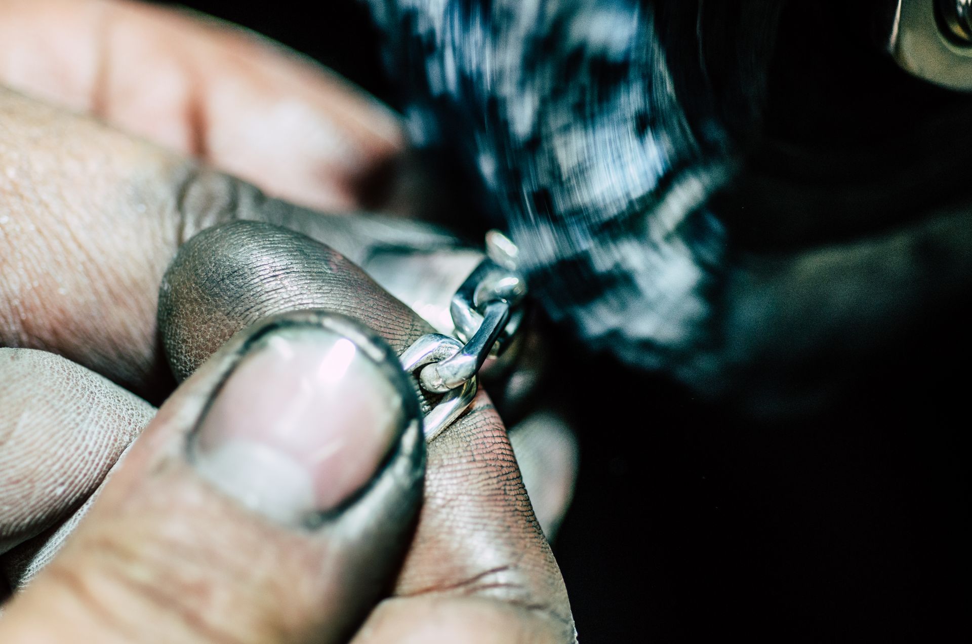 closeup on fingers working with metal