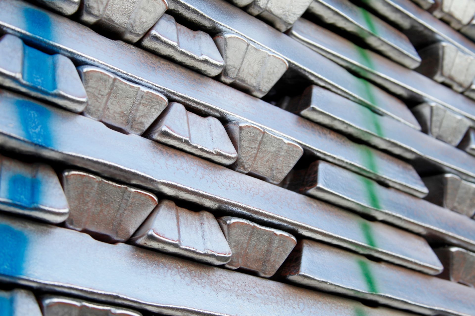 Stacks of aluminum bars in a warehouse